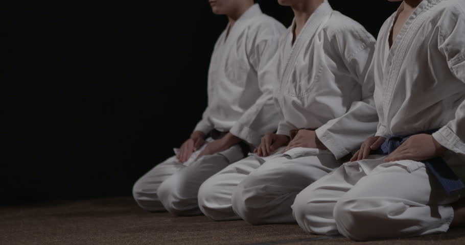 kneeling martial arts gi